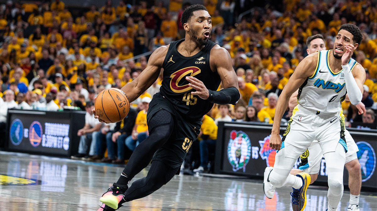 Cleveland Cavaliers guard Donovan Mitchell (45) dribbles the ball while Indiana Pacers guard Tyrese Haliburton (0) defends during game three of the second round for the 2025 NBA Playoffs at Gainbridge Fieldhouse.