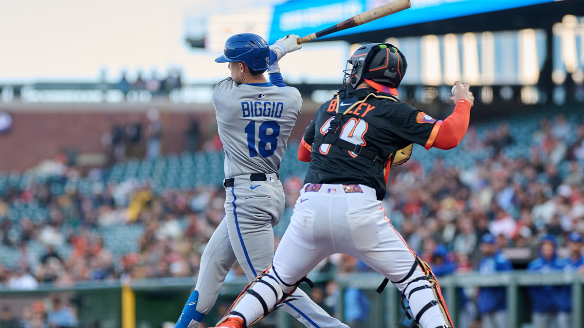 Kansas City Royals first baseman Cavan Biggio (18) strikes out and San Francisco Giants catcher Patrick Bailey (14) throws out Kansas City Royals third baseman Maikel Garcia (11) at second base during the second inning at Oracle Park.