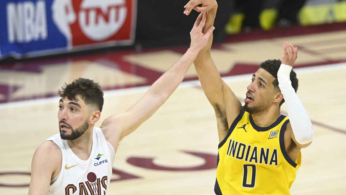 Cavs guard Ty Jerome (2) defends Indiana Pacers guard Tyrese Haliburton (0) on a follow through