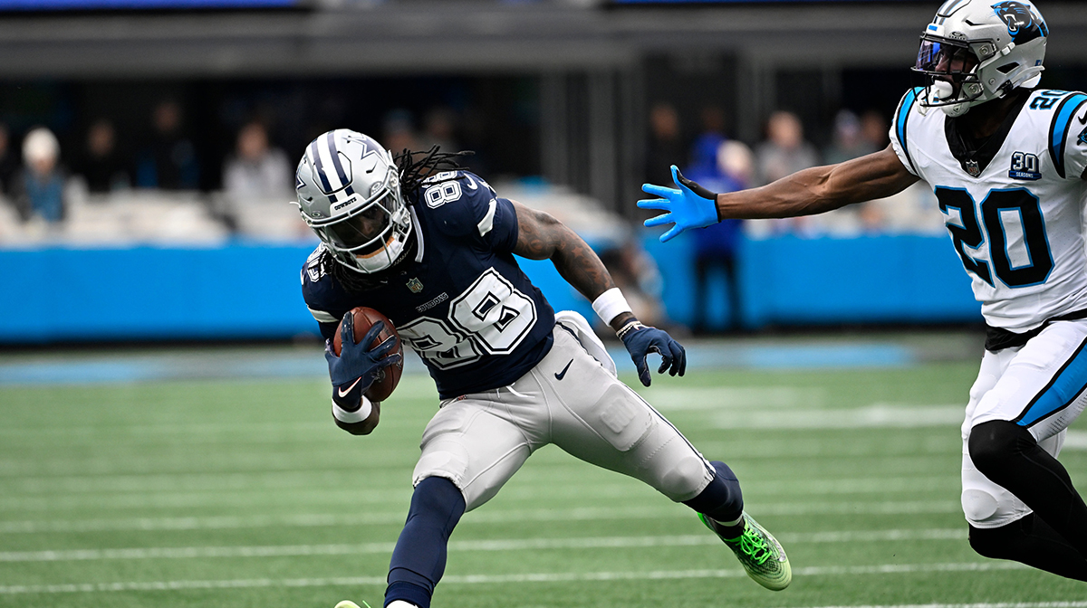Dallas Cowboys wide receiver CeeDee Lamb (88) with the ball as Carolina Panthers safety Jordan Fuller (20) defends in the second quarter at Bank of America Stadium.