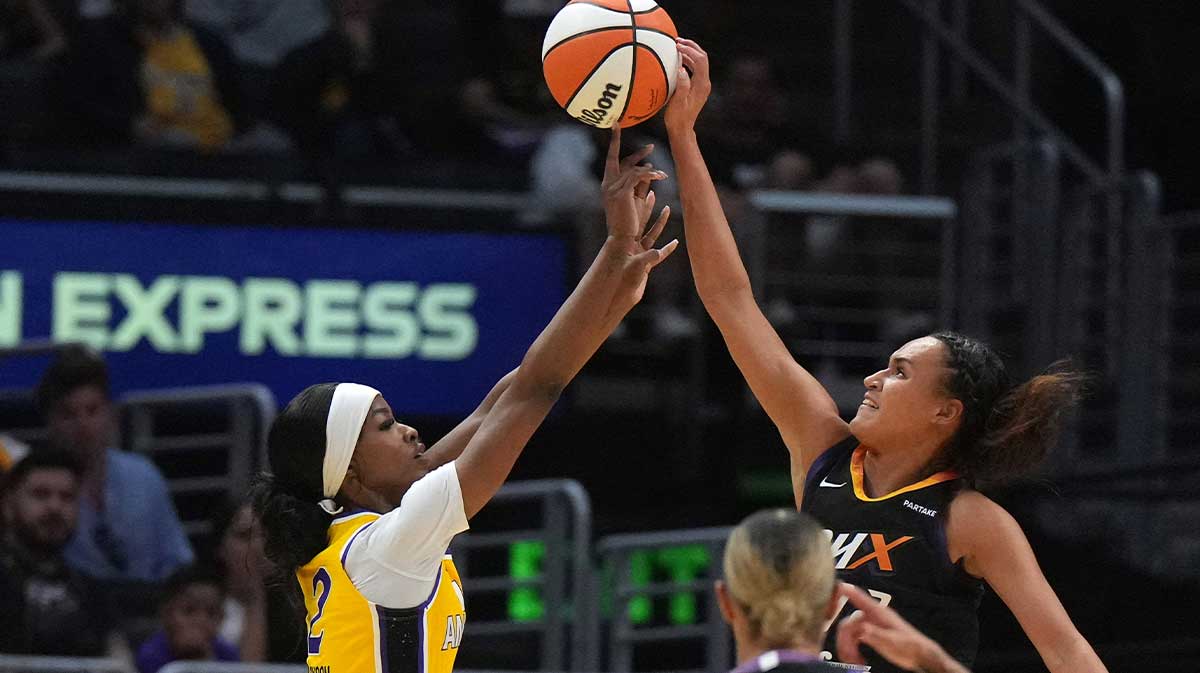Phoenix Mercury guard Celeste Taylor (12) blocks a shot by LA Sparks forward Rickea Jackson (2) in the first half at Crypto.com Arena.