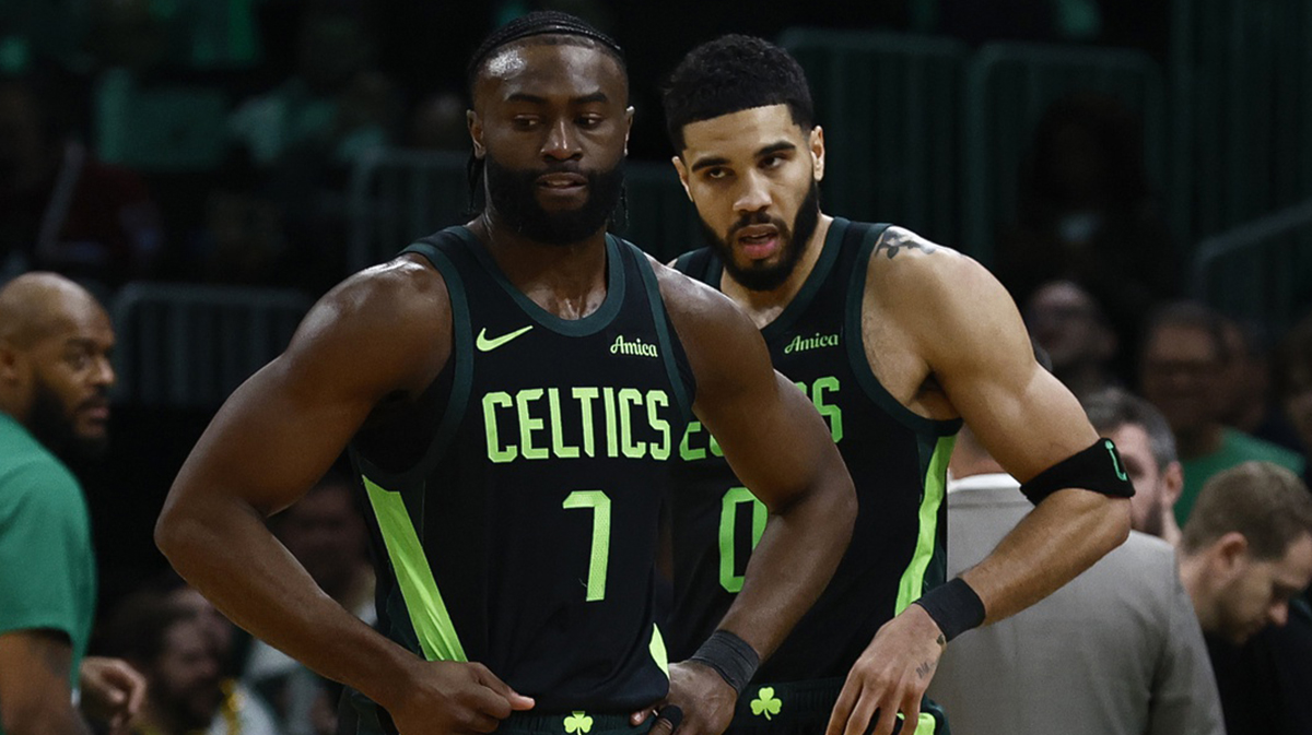 Boston Celtics guard Jaylen Brown (7) and forward Jayson Tatum (0) stand on the court during a timeout during the second half of their loss to the Cleveland Cavaliers at TD Garden