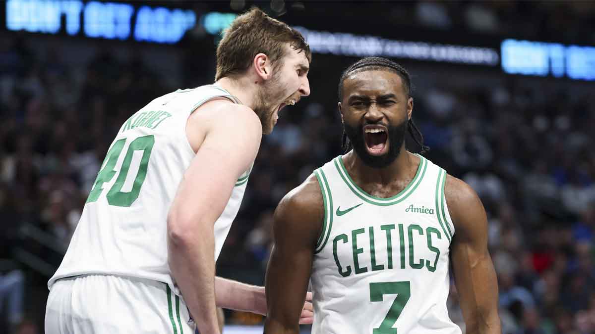 Celtics guard Jaylen Brown celebrates with Luke Kornet