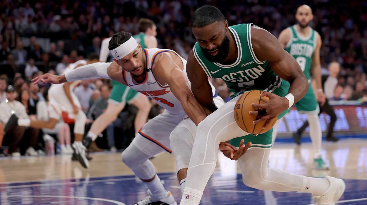 Celtics guard Jaylen Brown fights for the ball
