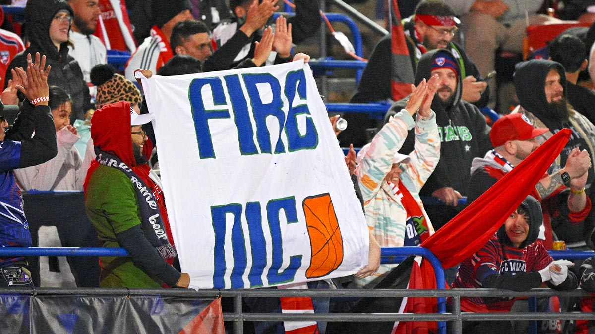 FC Dallas fans hold up a Fire Nico sign for Dallas Mavericks general manager Nico Harrison during the first half of the game between FC Dallas and Chicago Fire at Toyota Stadium.