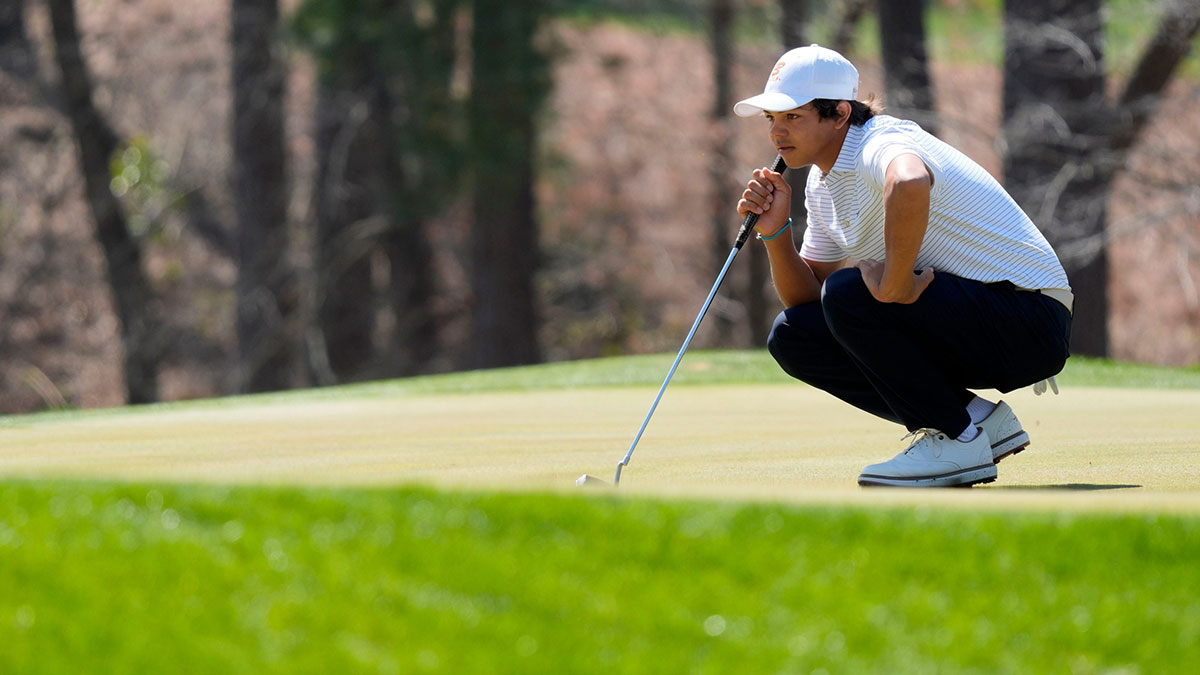 Charlie Woods lines up a putt on No. 10 green during the final round of the Junior Invitational at Sage Valley Golf Club