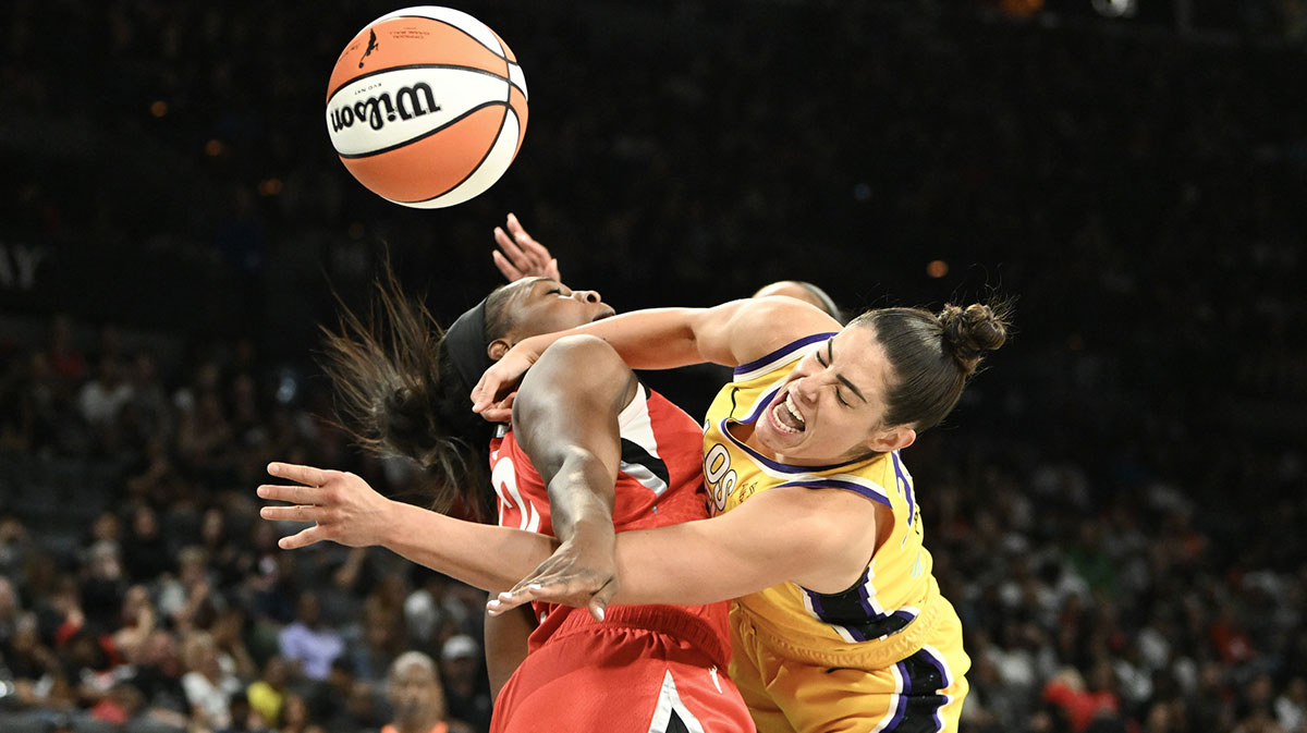 Las Vegas Aces guard Chelsea Gray (12) collides with Los Angeles Sparks guard Kelsey Plum (10) in the fourth quarter of their game at Michelob Ultra Arena.
