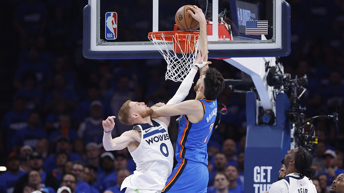 Oklahoma City Thunder forward Chet Holmgren (7) dunks against Minnesota Timberwolves guard Donte DiVincenzo (0) in the third quarter during game two of the western conference finals for the 2025 NBA Playoffs at Paycom Center.