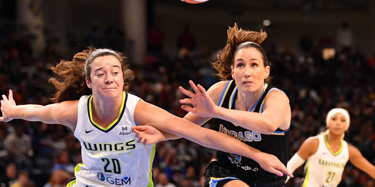 Dallas Wings forward Maddy Siegrist (20) and Chicago Sky guard Rebecca Allen (9) battle for the ball during the first half at the Wintrust Arena.
