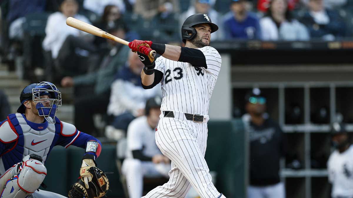 Chicago White Sox designated hitter Andrew Benintendi (23) hits a two-run double against the Texas Rangers during the sixth inning at Rate Field.