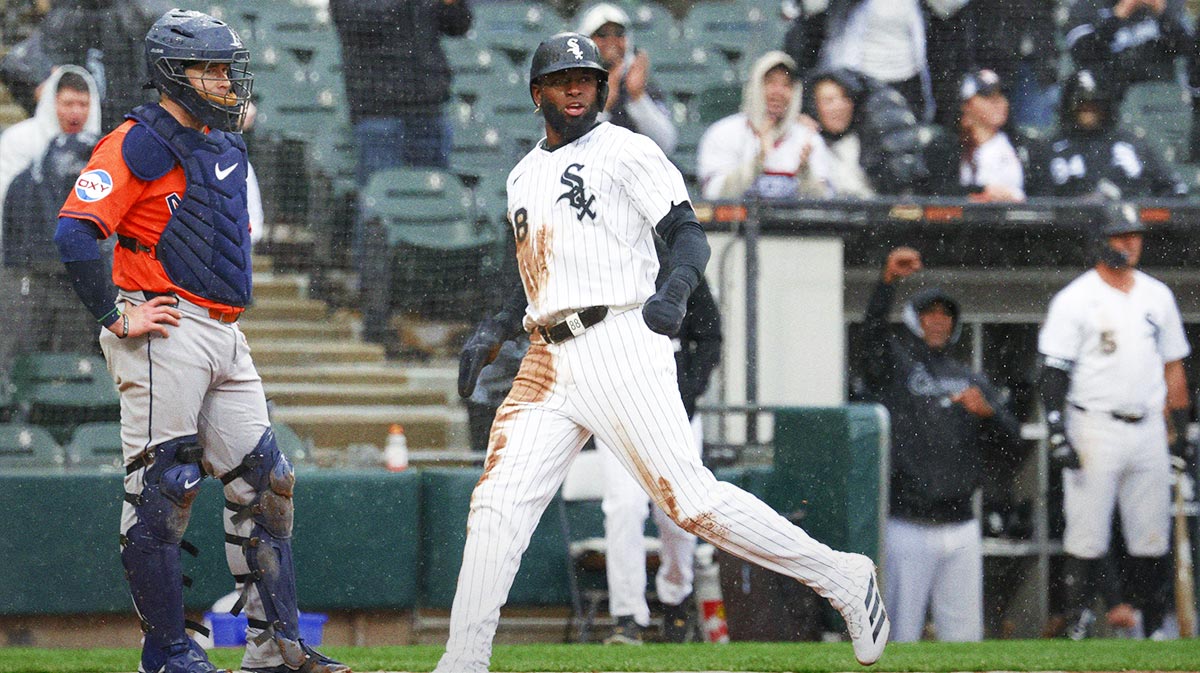 Chicago White Sox center fielder Luis Robert Jr. (88) scores against the Houston Astros during the sixth inning at Rate Field.