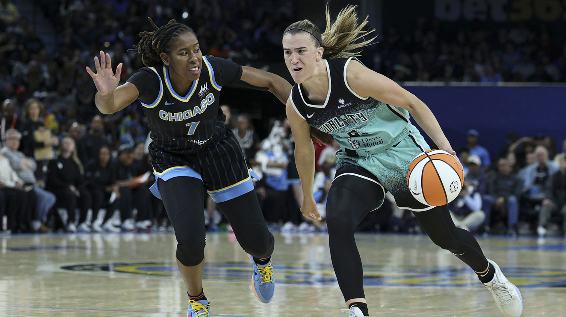 New York Liberty guard Sabrina Ionescu (20) drives to the basket against Chicago Sky guard Ariel Atkins (7) during the first half at Wintrust Arena.