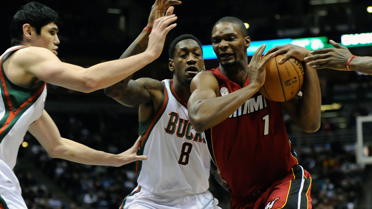 Miami Heat center Chris Bosh (1) drives for the basket against Milwaukee Bucks center Larry Sanders (8) at the Bradley Center.