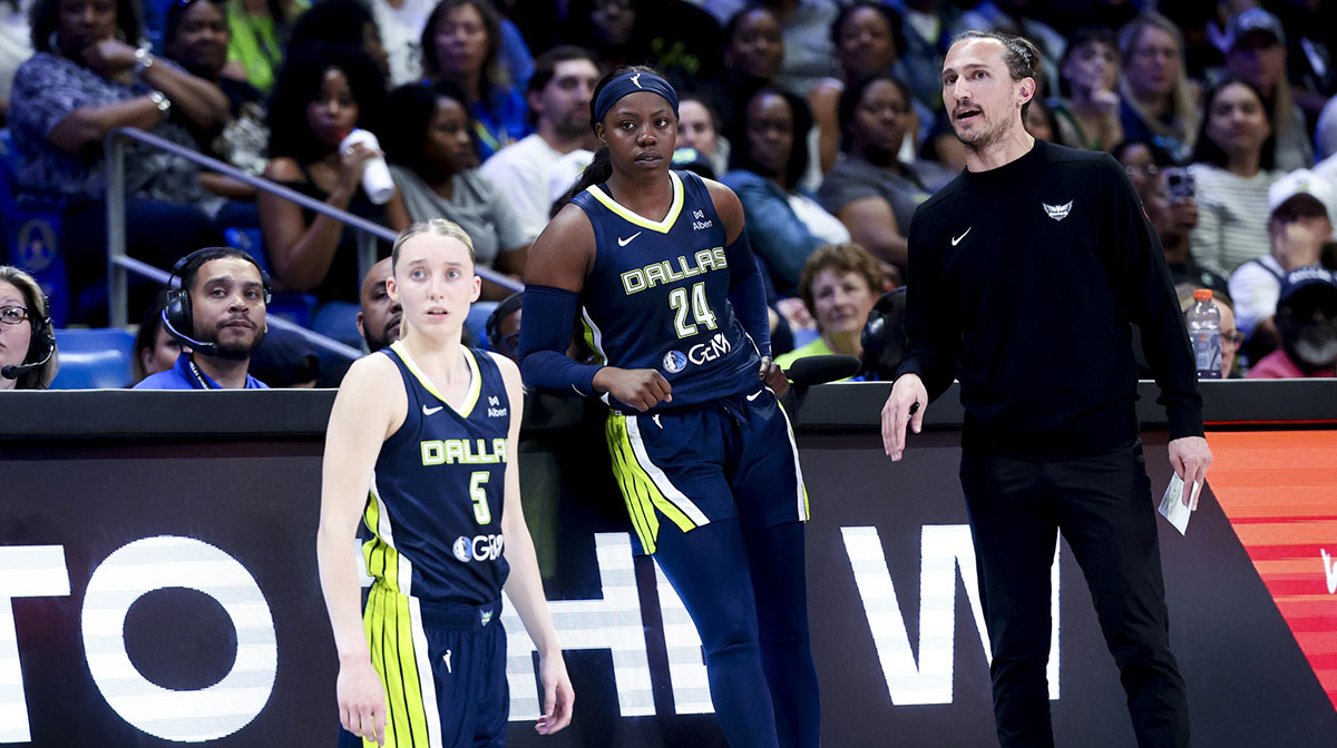 Dallas Wings guard Paige Bueckers (5) and Dallas Wings guard Arike Ogunbowale (24) and Dallas Wings head coach Chris Koclanes talk against the Minnesota Lynx during the first half at College Park Center.