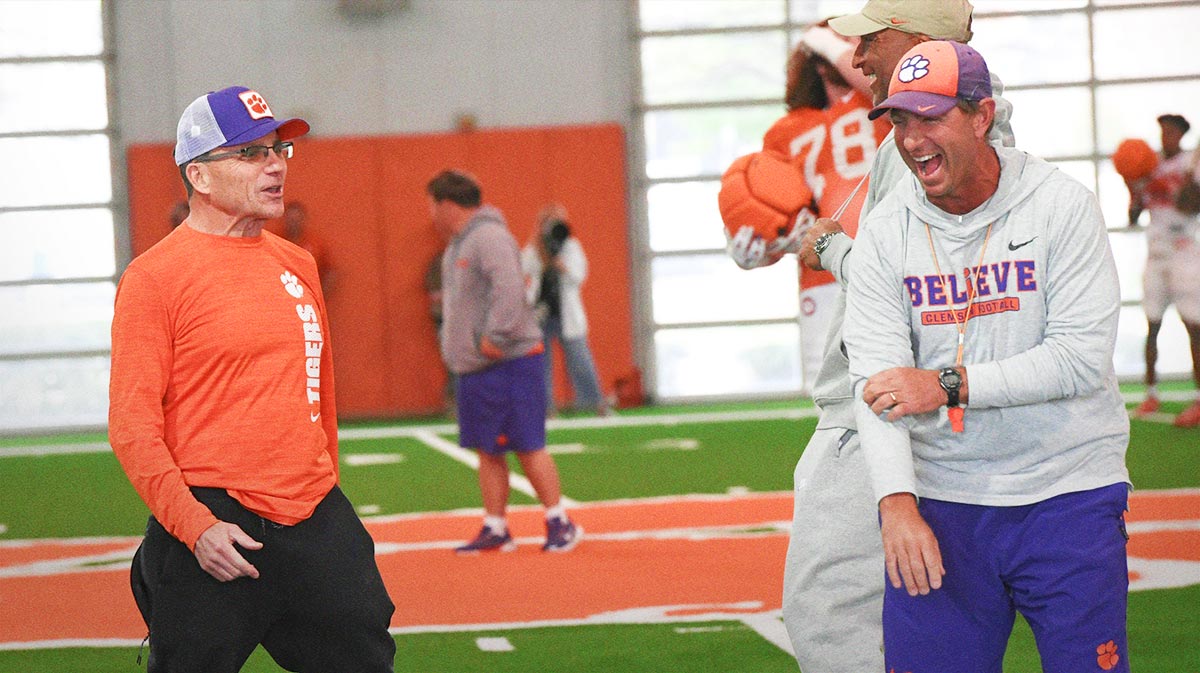 Kevin Kelly, Director of Player Evaluation & Acquisition laughs with Head Coach Dabo Swinney during Spring Practice in Clemson, S.C.