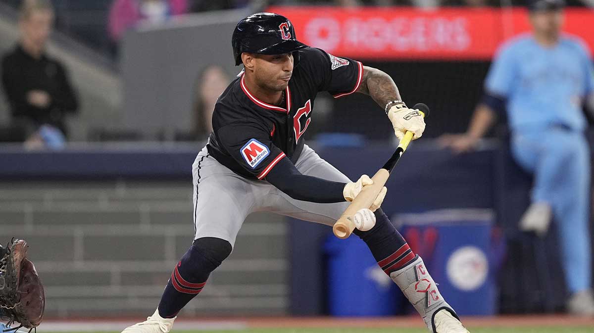 Cleveland Guardians pinch hitter Brayan Rocchio (4) gets out after three unsuccessful bunt attempts against the Toronto Blue Jays during the ninth inning at Rogers Centre.