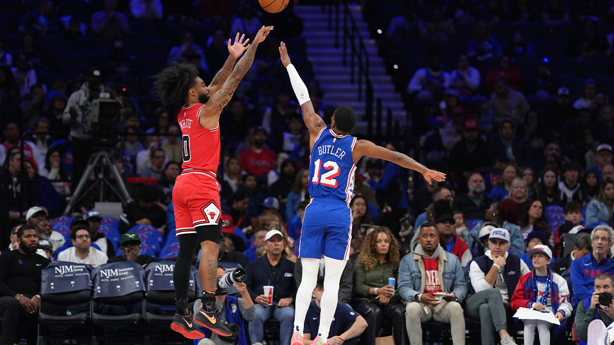 Chicago Bulls guard Coby White (0) shoots the ball against Philadelphia 76ers guard Jared Butler (12) in the first quarter at Wells Fargo Center.