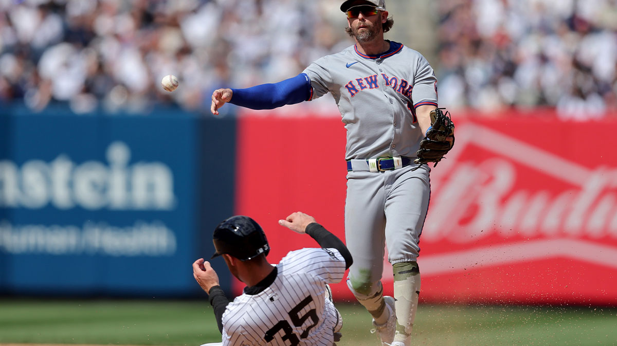New York Mets second baseman Jeff McNeil (1) forces out New York Yankees center fielder Cody Bellinger (35) at second base and throws to first to complete a double play on a ball hit by Yankees first baseman Paul Goldschmidt (not pictured) during the eighth inning at Yankee Stadium.