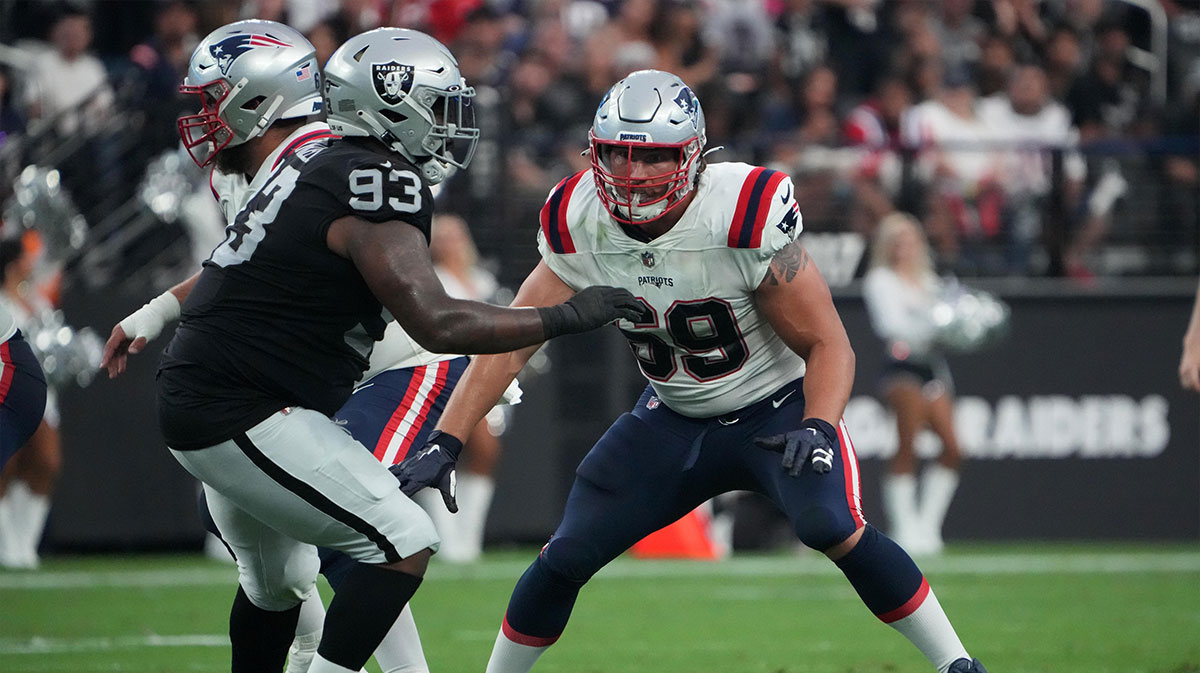 New England Patriots guard Cole Strange (69) defends against Las Vegas Raiders defensive tackle Neil Farrell Jr. (93) at Allegiant Stadium.