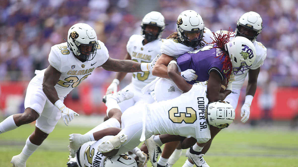TCU Horned Frogs wide receiver Savion Williams (3) is tackled by Colorado Buffaloes cornerback Omarion Cooper (3) in the first quarter at Amon G. Carter Stadium.