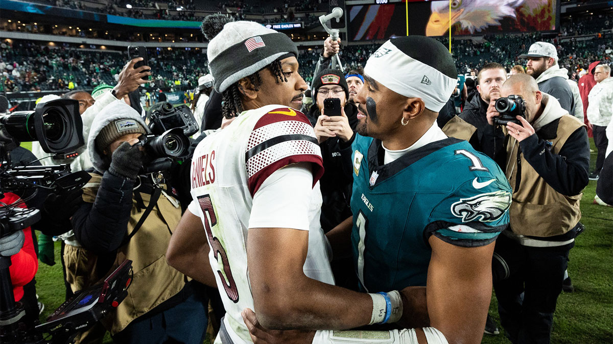 Philadelphia Eagles quarterback Jalen Hurts (1) and Washington Commanders quarterback Jayden Daniels (5) shake hands after an Eagles victory at Lincoln Financial Field.