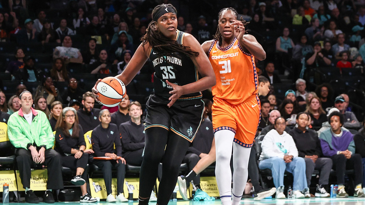 New York Liberty center Jonquel Jones (35) looks to drive past Connecticut Sun center Tina Charles (31) in the first quarter at Barclays Center.