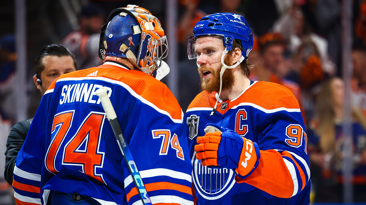 Edmonton Oilers goaltender Stuart Skinner (74) and center Connor McDavid (97) celebrates win after defeating Florida Panthers in game six of the 2024 Stanley Cup Final at Rogers Place.