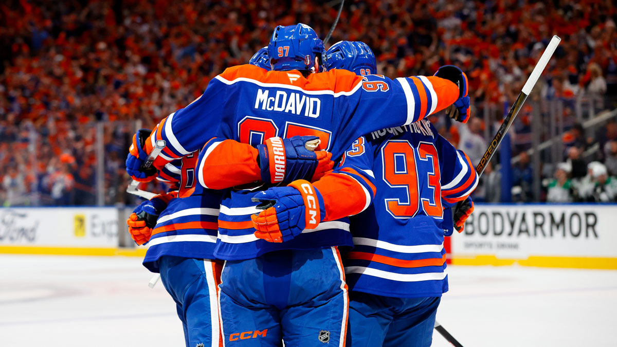 Edmonton Oilers left wing Zach Hyman (18) and center Connor McDavid (97) celebrates a goal scored by McDavid against the Dallas Stars during the first period in game three of the Western Conference Final of the 2025 Stanley Cup Playoffs at Rogers Place.