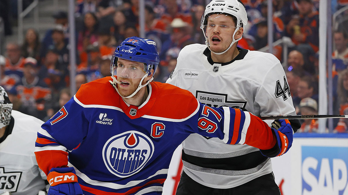 Edmonton Oilers forward Connor McDavid (97) and Los Angeles Kings defensemen Mikey Anderson (44) battles for position during the third period in game six of the first round of the 2025 Stanley Cup Playoffs at Rogers Place.