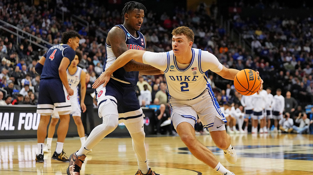 Duke Blue Devils forward Cooper Flagg (2) drives to the basket against Arizona Wildcats guard Jaden Bradley (0) during the second half during an East Regional semifinal of the 2025 NCAA tournament at Prudential Center.