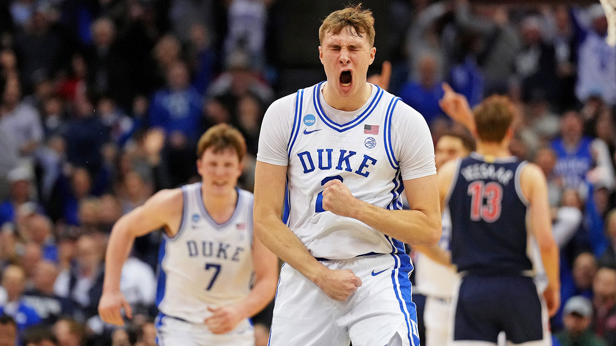 Duke Blue Devils forward Cooper Flagg (2) reacts after making a last second shot to end the first half against the Arizona Wildcats during an East Regional semifinal of the 2025 NCAA tournament at Prudential Center.