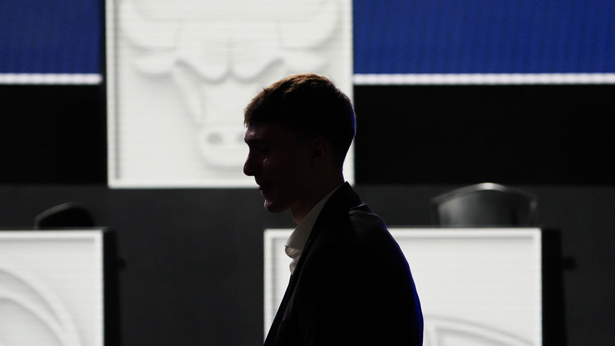 Cooper Flagg walks to his seat during the 2025 NBA Draft Lottery at McCormick Place.