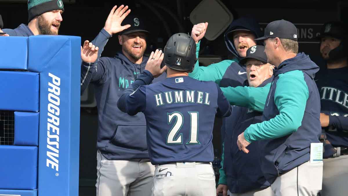 Seattle Mariners designated hitter Cooper Hummel (21) celebrates after scoring during the fifth inning against the Cleveland Guardians at Progressive Field.