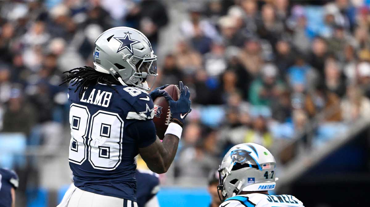 Dallas Cowboys wide receiver CeeDee Lamb (88) with the ball as Carolina Panthers linebacker Josey Jewell (47) defends in the second quarter at Bank of America Stadium.
