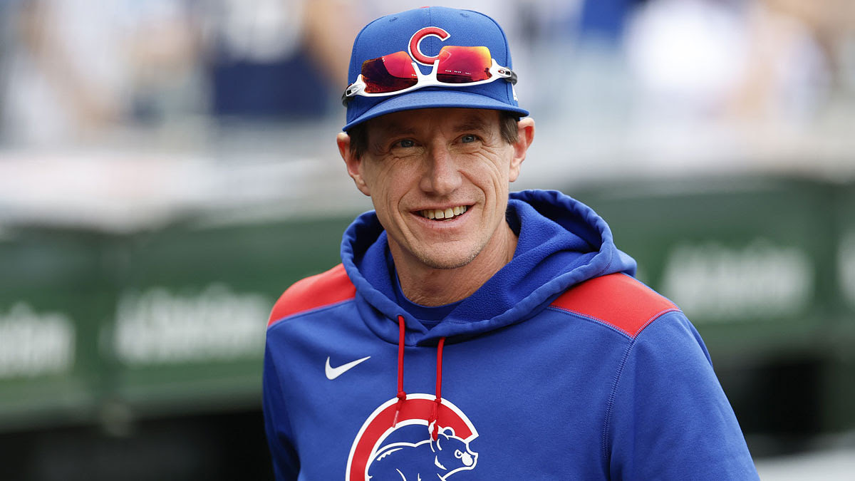 Chicago Cubs manager Craig Counsell (11) smiles before a game between the Cubs and Arizona Diamondbacks .