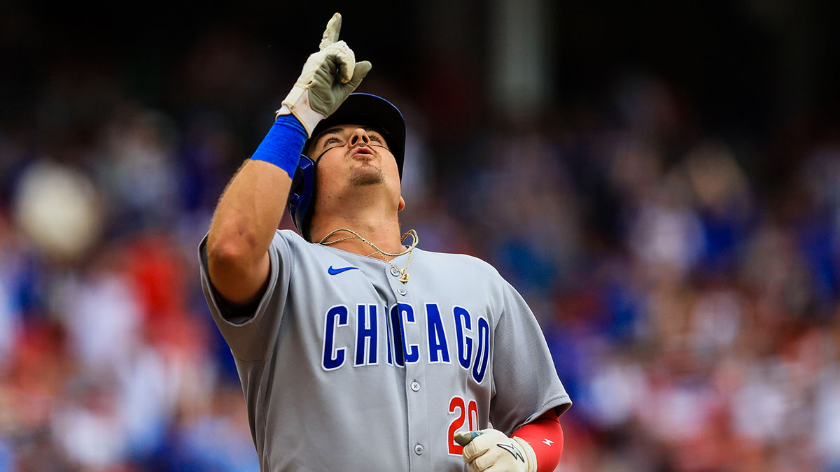Chicago Cubs catcher Reese McGuire (20) reacts after hitting a solo home run in the eighth inning against the Cincinnati Reds at Great American Ball Park.