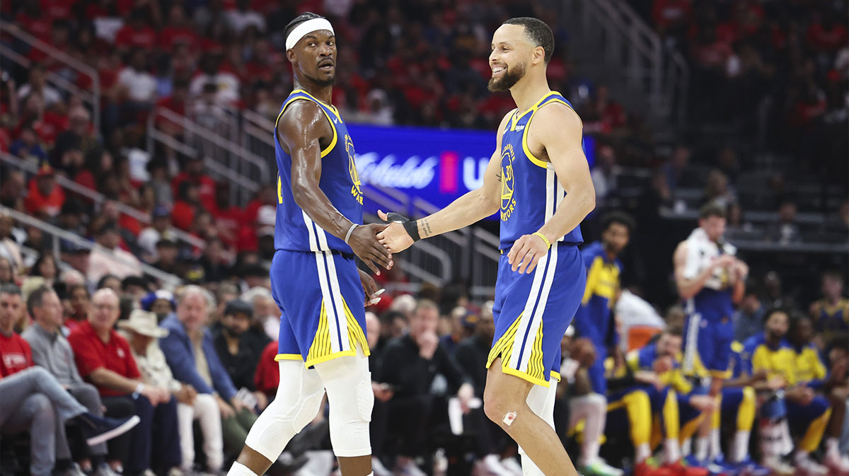 Golden State Warriors guard Stephen Curry (30) celebrates with forward Jimmy Butler III (10) after a play during the second quarter against the Houston Rockets at Toyota Center.