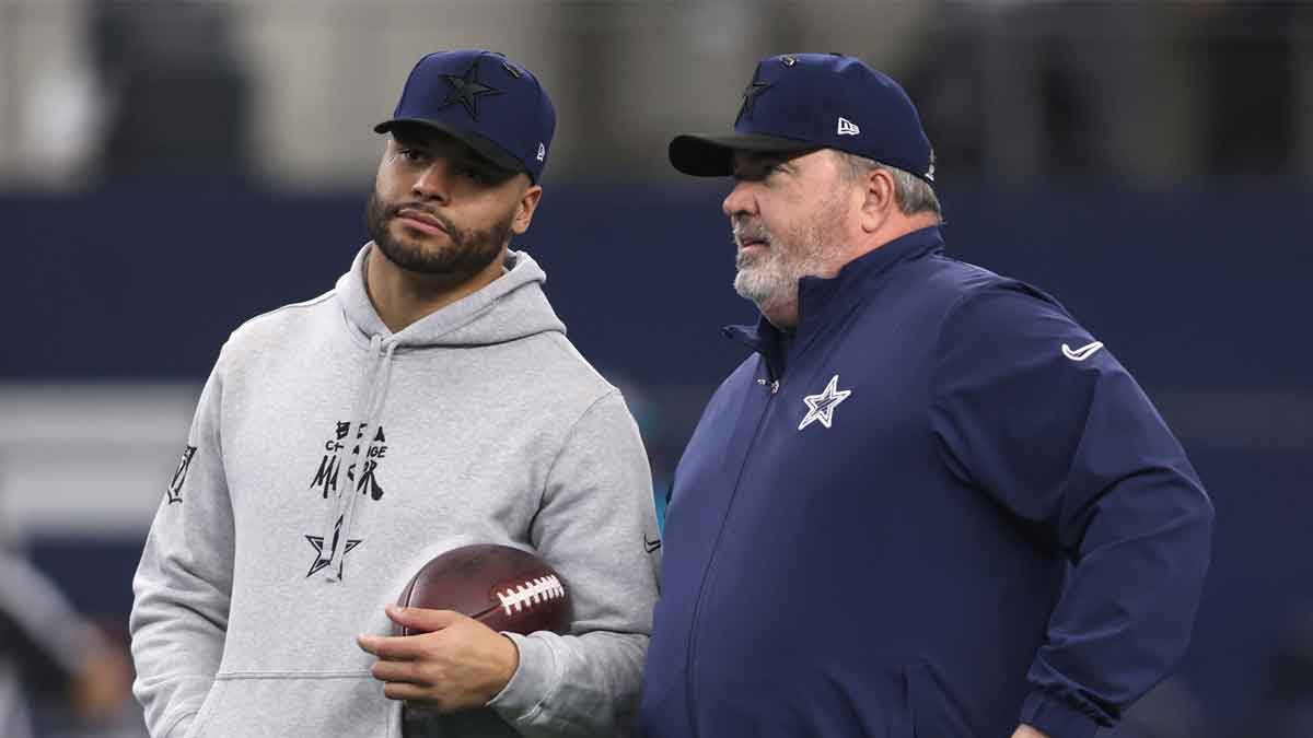 Jan 5, 2025; Arlington, Texas, USA; Dallas Cowboys quarterback Dak Prescott (4) talks to head coach Mike McCarthy before the game against the Washington Commanders at AT&T Stadium. Mandatory Credit: Tim Heitman-Imagn Images