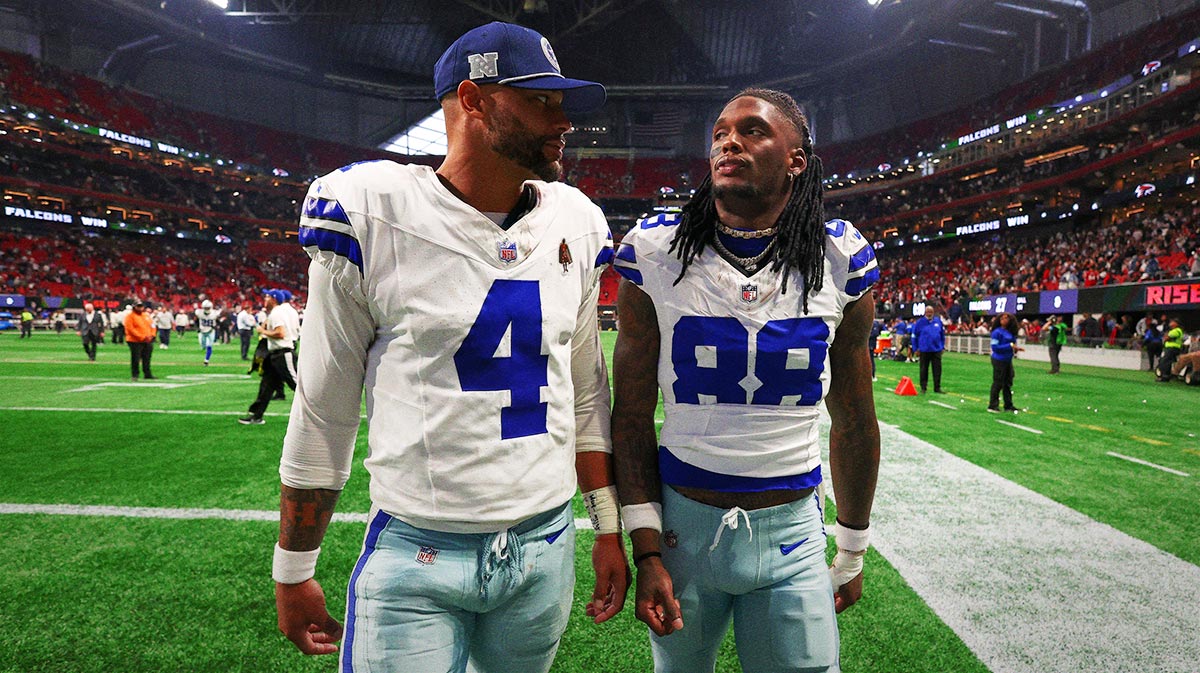 Dallas Cowboys quarterback Dak Prescott (4) and wide receiver CeeDee Lamb (88) walk off the field after a loss against the Atlanta Falcons at Mercedes-Benz Stadium.