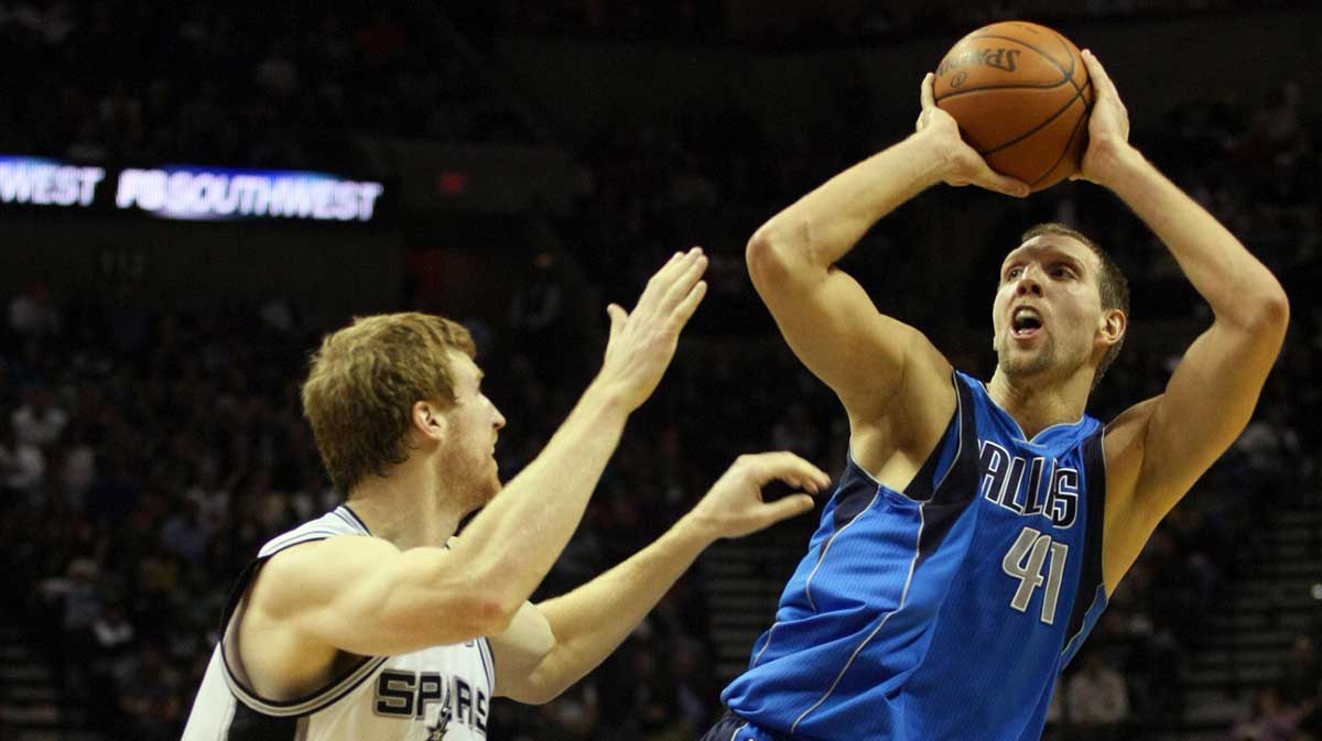 NBA Dallas Mavericks forward Dirk Nowitzki (41) shoots over San Antonio Spurs forward Matt Bonner (15) during the second half at the AT&T Center. The Mavericks won 103-94.
