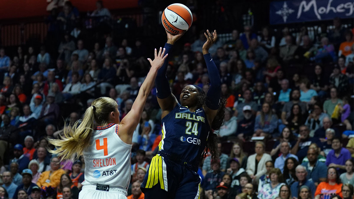 Dallas Wings guard Arike Ogunbowale (24) shoots the ball against Connecticut Sun guard Jacy Sheldon (4) in the first half at Mohegan Sun Arena.