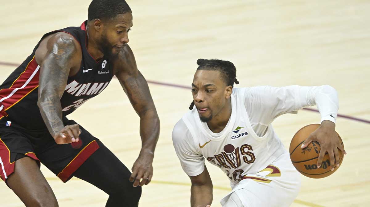 Miami Heat forward Haywood Highsmith (24) defends Cleveland Cavaliers guard Darius Garland (10) in the fourth quarter of game two of the first round of the 2025 NBA Playoffs at Rocket Arena.
