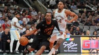 Cleveland Cavaliers guard Darius Garland (10) drives past San Antonio Spurs guard Devin Vassell (24) in the first half at Frost Bank Center.