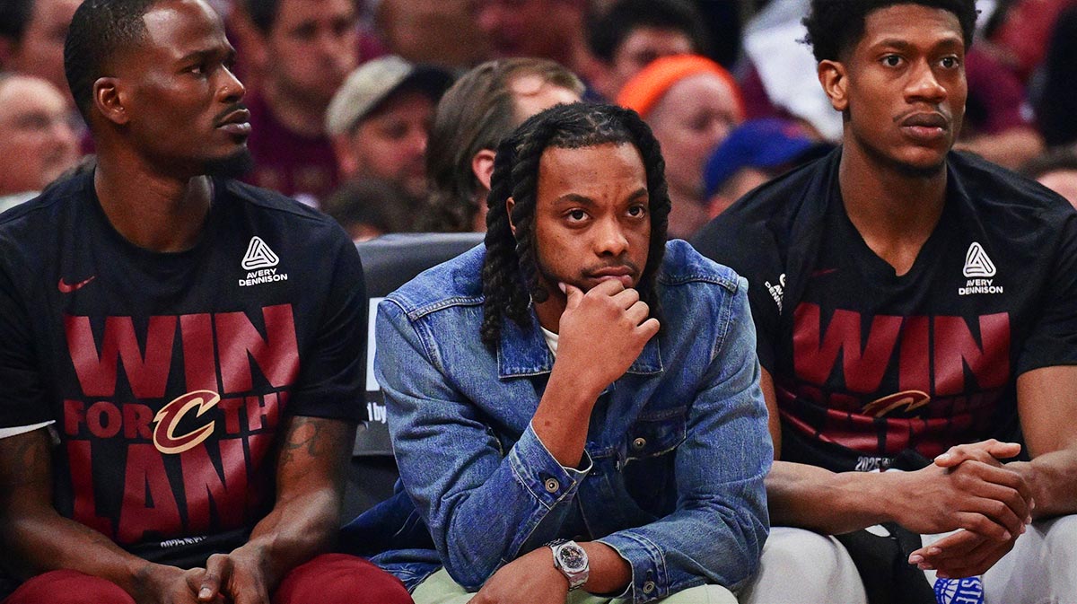 Cleveland Cavaliers guard Darius Garland, middle, watches from the bench during the first half against the Indiana Pacers in game one of the second round for the 2025 NBA Playoffs at Rocket Arena.
