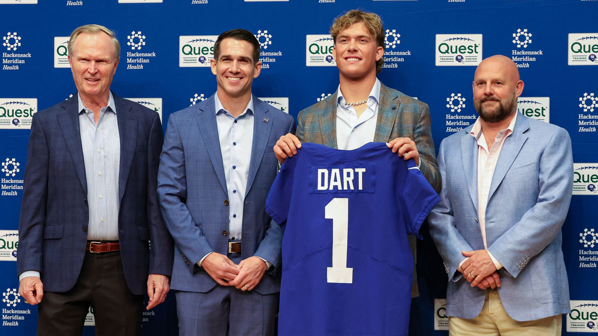 Apr 25, 2025; East Rutherford, NJ, US; New York Giants president John Mara (far left), general manager Joe Schoen (left), Jaxson Dart, and head coach Brian Daboll (right) pose for photos prior to the start of the press conference to introduce the Giants first round draft picks.