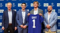Apr 25, 2025; East Rutherford, NJ, US; New York Giants president John Mara (far left), general manager Joe Schoen (left), Jaxson Dart, and head coach Brian Daboll (right) pose for photos prior to the start of the press conference to introduce the Giants first round draft picks.