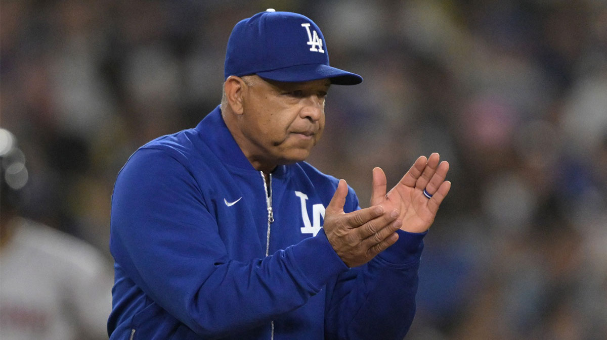 Los Angeles Dodgers manager Dave Roberts (30) walks to the mound for a pitching change in the eighth inning against the Arizona Diamondbacks at Dodger Stadium.