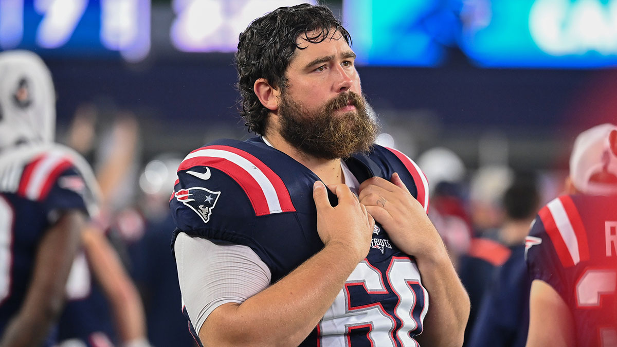 New England Patriots center David Andrews (60) watches from the sideline during the first half against the Carolina Panthers at Gillette Stadium.