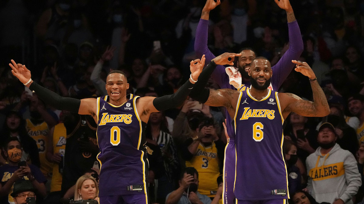 Los Angeles Lakers forward LeBron James (6) guard Russell Westbrook (0) and center DeAndre Jordan (10) watch game action against the Cleveland Cavaliers during the second half at Staples Center.