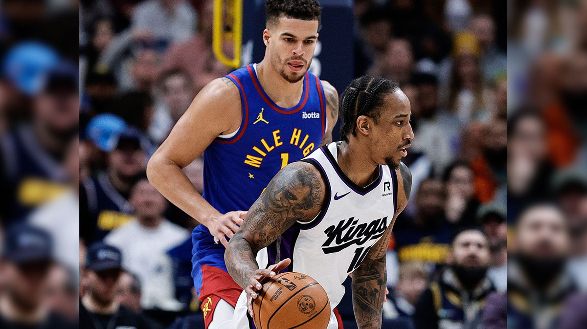Sacramento Kings forward DeMar DeRozan (10) controls the ball as Denver Nuggets forward Michael Porter Jr. (1) guards in the first quarter at Ball Arena.